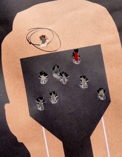 Close up of paper head target with bullet holes
