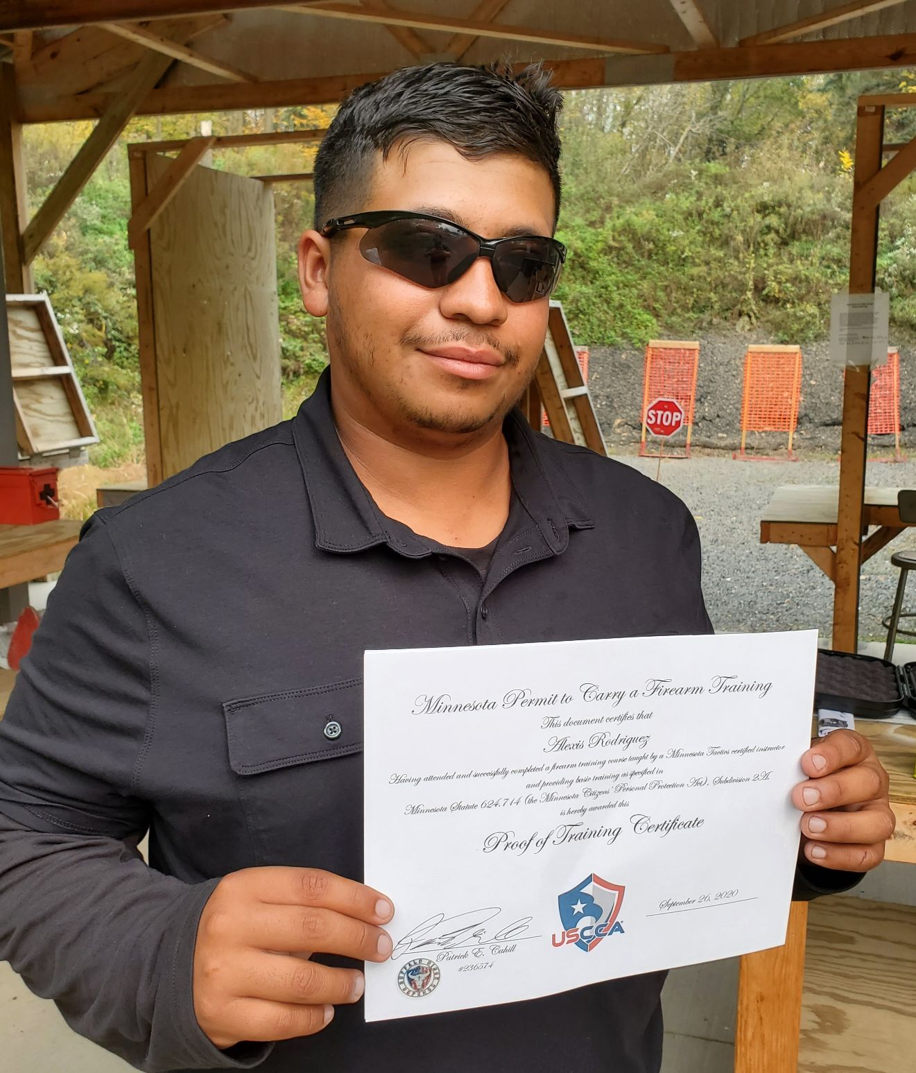 man holding certificate